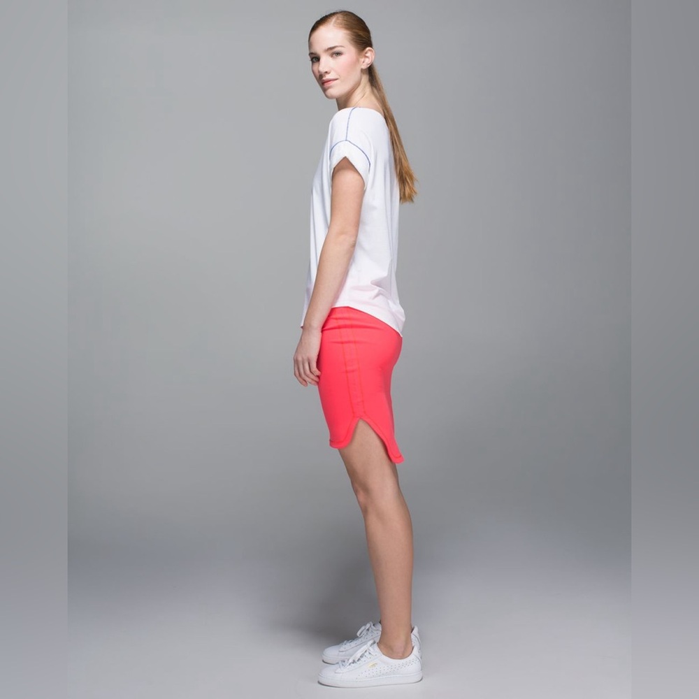 Lululemon City Skirt
in Electric Coral. 
Size 4. 
Pristine Condition.